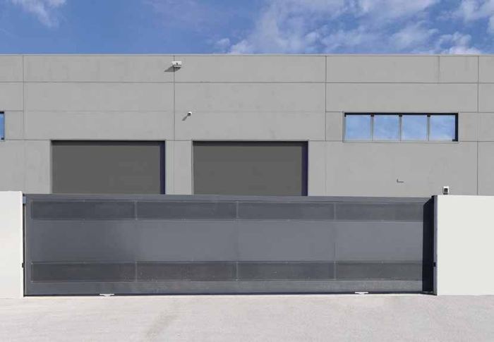 Automated industrial sliding gate on a Centurion SMART+ operator